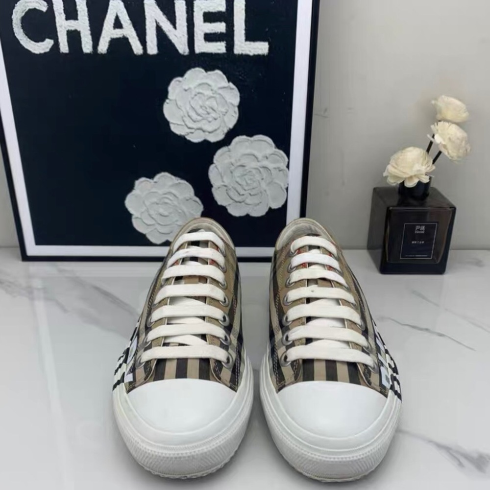 Burberry Women's Sneakers - Striped Black, White, and Brown